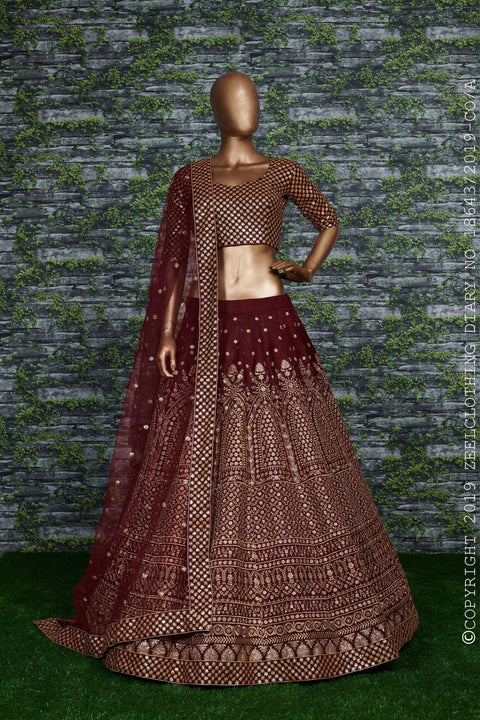 Maroon raw silk blouse adorned with gold sequin embroidery. lehenga choli for women