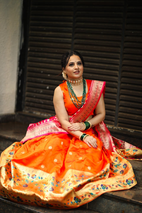 Get traditional touch to your look adorning this orange color lehenga in jacquard material For Women