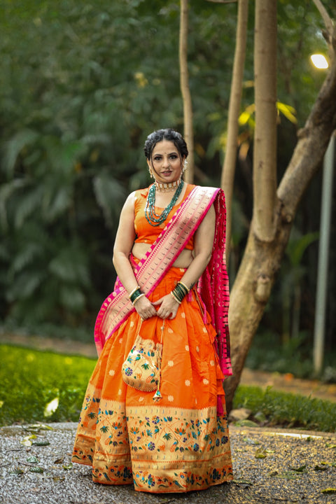 Get traditional touch to your look adorning this orange color lehenga in jacquard material For Women