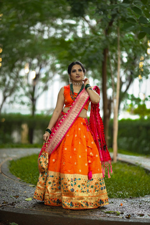 Get traditional touch to your look adorning this orange color lehenga in jacquard material For Women