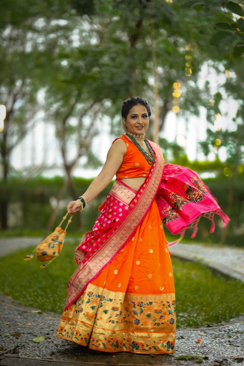 Get traditional touch to your look adorning this orange color lehenga in jacquard material For Women