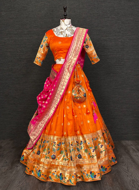 Get traditional touch to your look adorning this orange color lehenga in jacquard material For Women