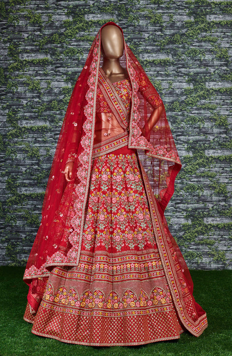 Add The Red Sense Of Feminine Beauty By This Gleaming Red Colored Wedding Lehenga Choli.