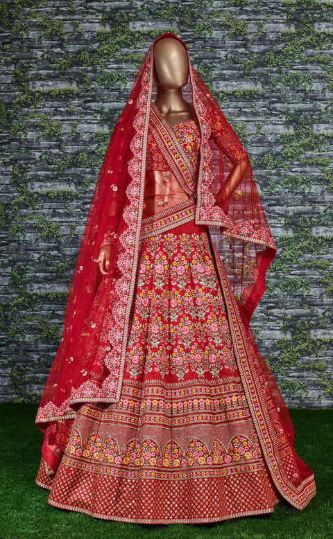 Add The Red Sense Of Feminine Beauty By This Gleaming Red Colored Wedding Lehenga Choli.