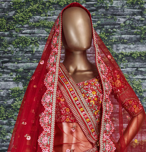 Add The Red Sense Of Feminine Beauty By This Gleaming Red Colored Wedding Lehenga Choli.