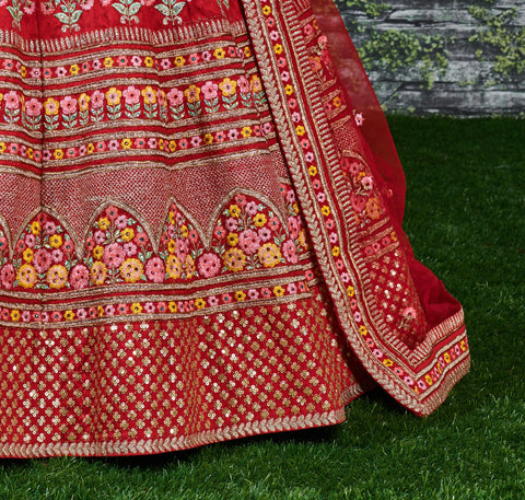 Add The Red Sense Of Feminine Beauty By This Gleaming Red Colored Wedding Lehenga Choli.