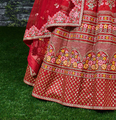 Add The Red Sense Of Feminine Beauty By This Gleaming Red Colored Wedding Lehenga Choli.