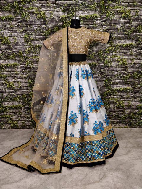 Radiant White Botanical Flower Butta printed on lehengas with Heavily Embroidered blouse.