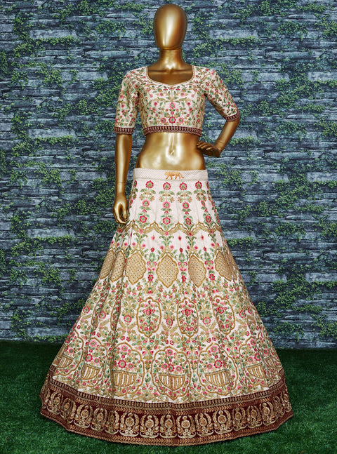 Elegant Make you're ethnic look more stylish & classic with this gleaming Cream-colored taffeta silk lehenga choli