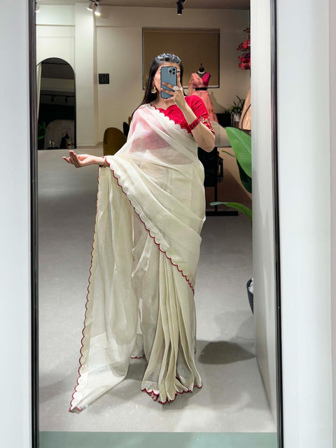 White manipuri Tussar saree is detailed with arca work on the borders of the saree is just perfect attire for any kind of event