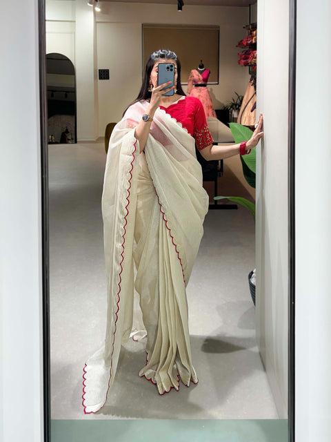 White manipuri Tussar saree is detailed with arca work on the borders of the saree is just perfect attire for any kind of event