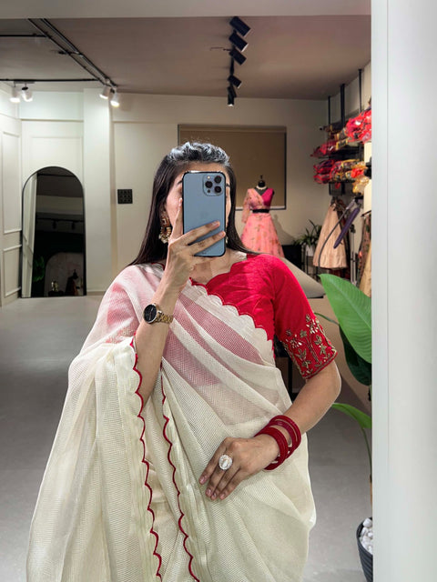 White manipuri Tussar saree is detailed with arca work on the borders of the saree is just perfect attire for any kind of event